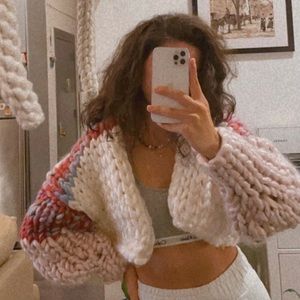 This is a handmade chunky cardigan, made by roving.